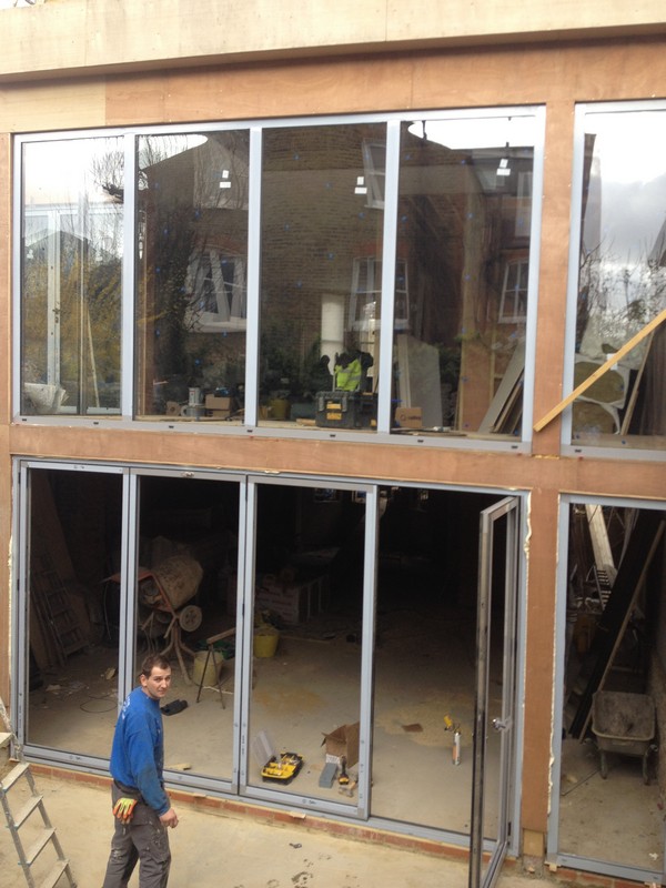 Aluminium bi-fold doors with two-storey glazing in Grove Park