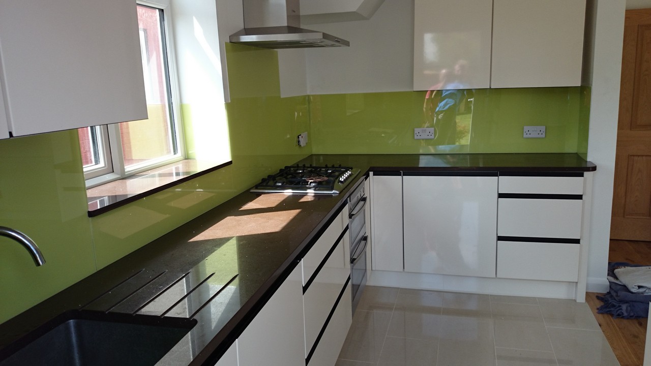 Lime green glass kitchen splashback installed by Grove Park glaziers