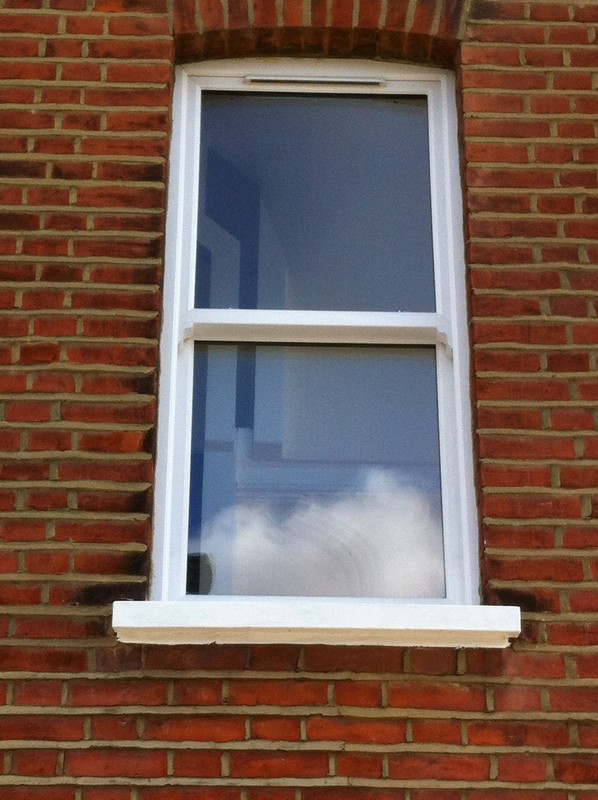 uPVC sash window on Victorian red brick house in Grove Park